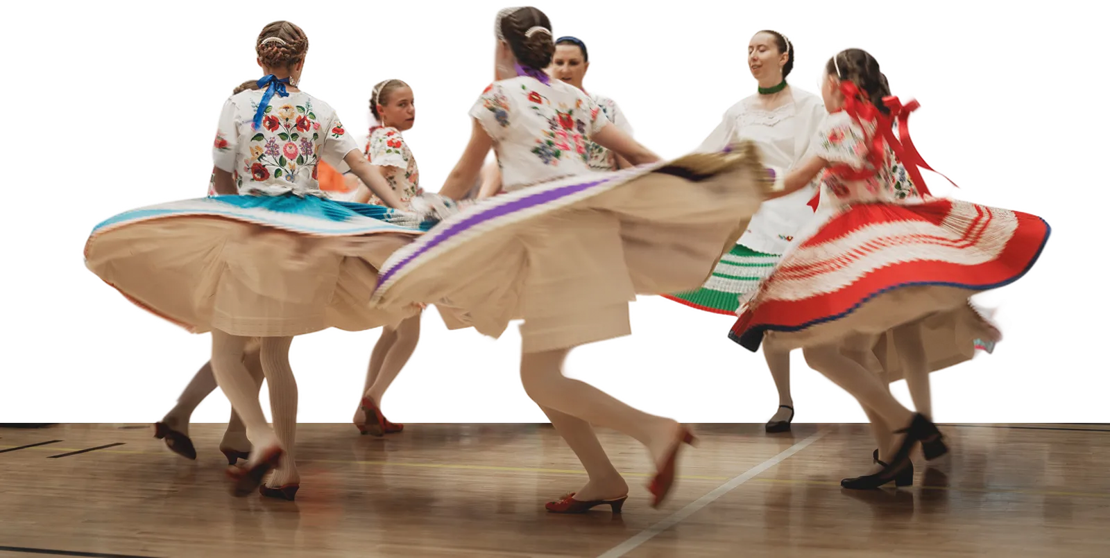 Nádihegedű dancers spinning in embroidered folk dress
